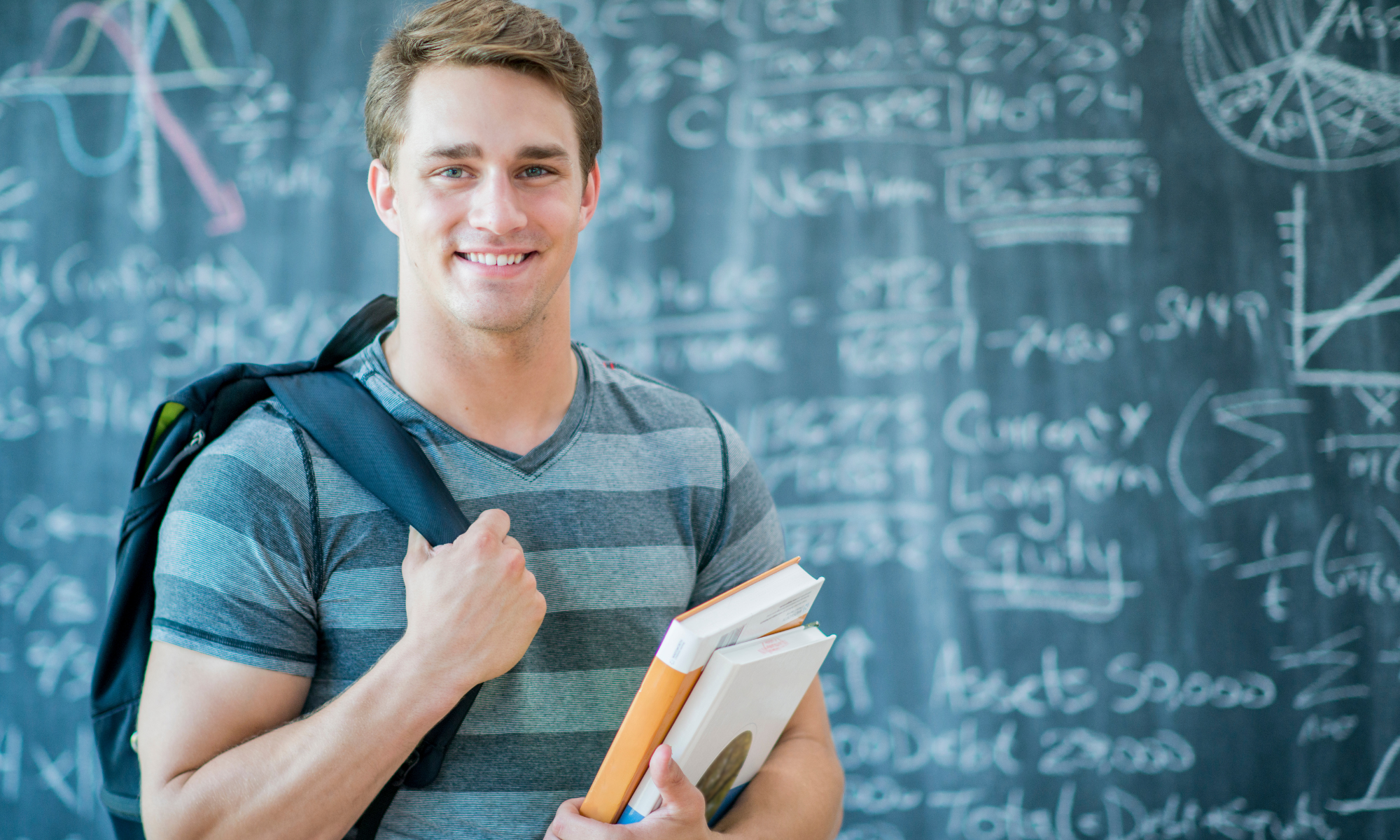 Top Ivy League Admissions Consultants Student in front of a chalkboard | The Best Ivy League Admissions Consultants