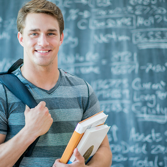 Top Ivy League Admissions Firms College Pass | Student in front of a chalkboard | Best Ivy League Consultants